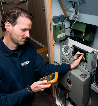 Radio Holland Technician checking equipment