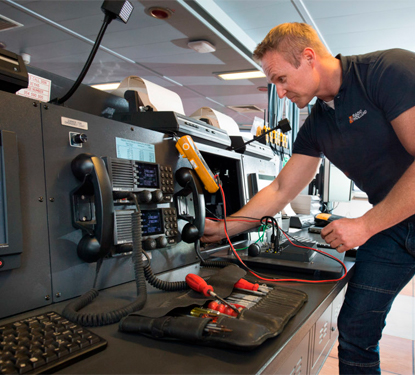 Radio Holland technician at work on a vessel