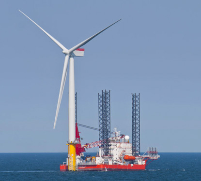 Jackup vessel assisting with construction at a offshore windpark