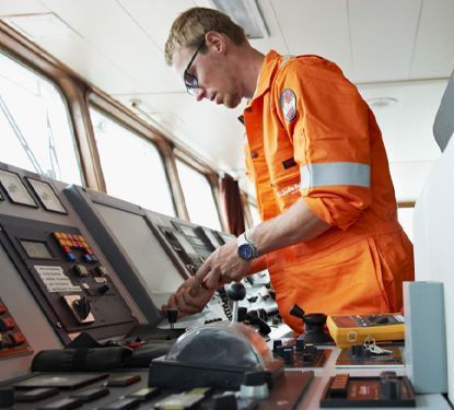 Service Technician at work on bridge console