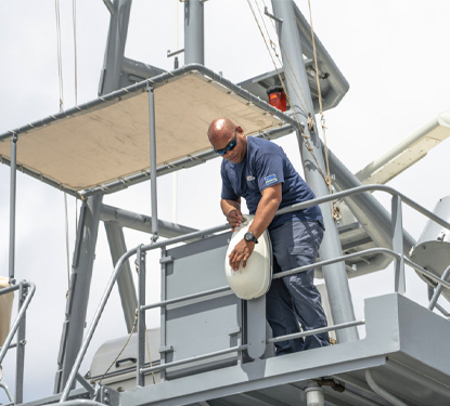 Radio Holland Technician servicing Coastguard vessel on Curacao